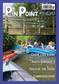 The front cover of PinPoint Issue 10 showing four people in a blue inflatable boat on a narrow river surrounded by trees and hedges looking up at a wooden bridge above them